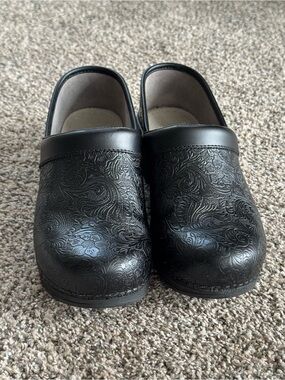 Dansko Professional LT Pro clogs in black floral tooled leather.